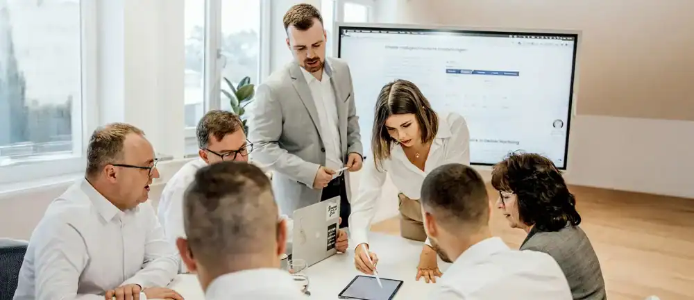 Fractional CMO leading executive team meeting to discuss marketing strategy and business growth initiatives.